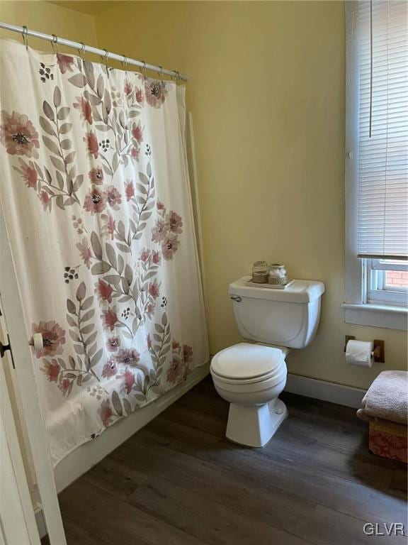 bathroom featuring hardwood / wood-style floors and toilet