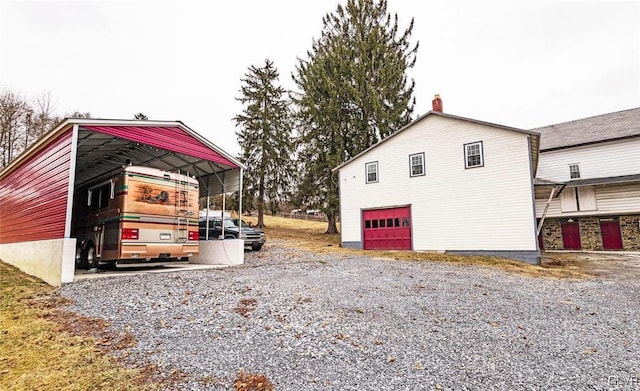 view of property exterior featuring a carport