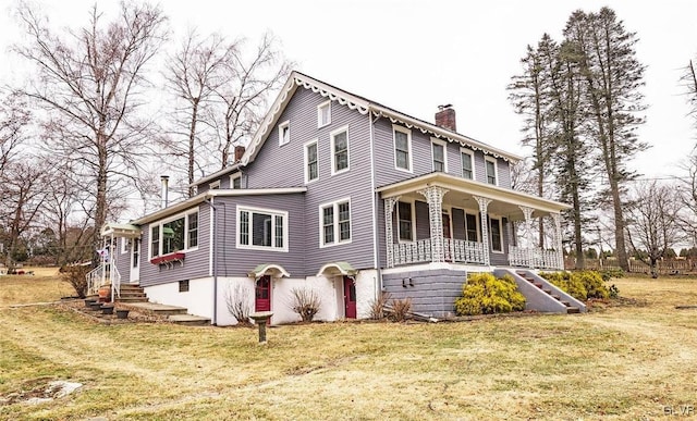 view of front of house featuring covered porch and a front lawn