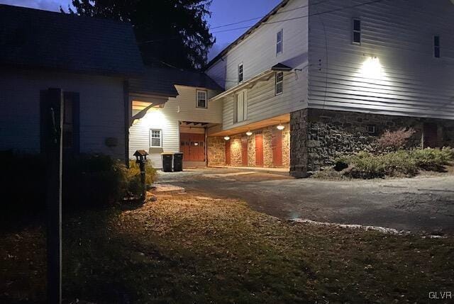 view of property exterior with a garage