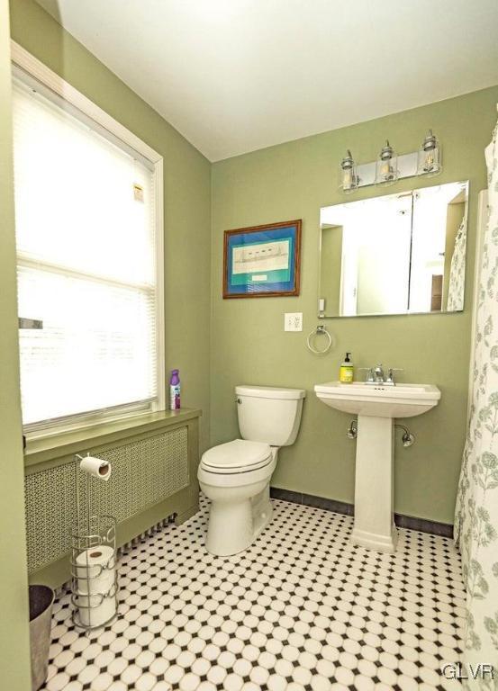 bathroom with toilet and sink