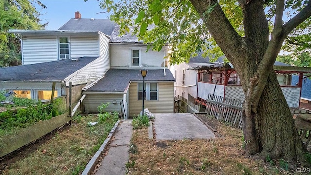 back of property featuring a patio area