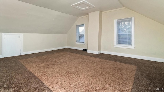 bonus room featuring carpet flooring and vaulted ceiling