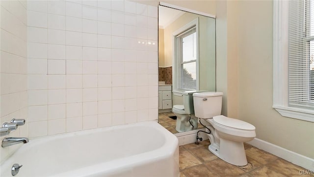 bathroom with tile patterned floors, a bathing tub, and toilet