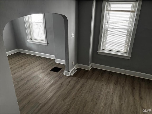 spare room featuring dark hardwood / wood-style floors