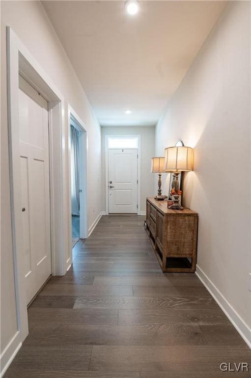 corridor with dark wood-type flooring