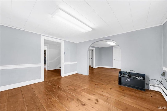 spare room featuring wood-type flooring