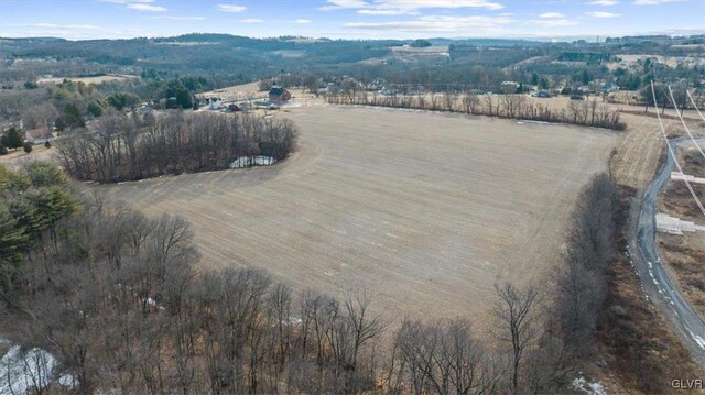 birds eye view of property with a rural view