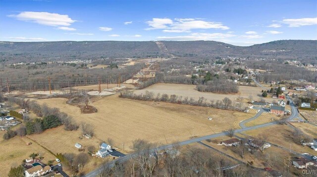 aerial view featuring a mountain view and a rural view