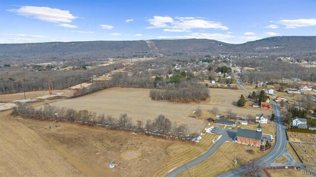 drone / aerial view featuring a rural view and a mountain view