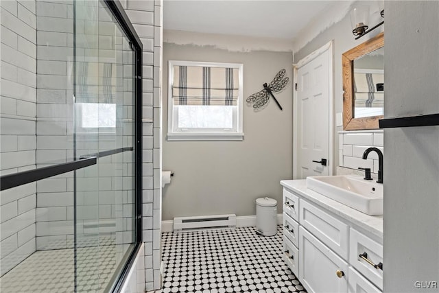 bathroom with vanity and a baseboard heating unit