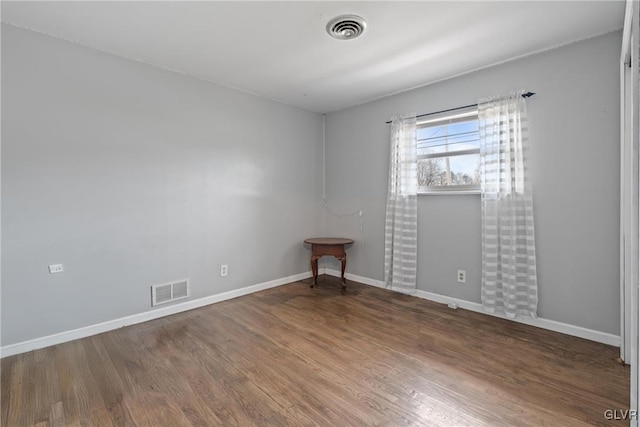 spare room featuring hardwood / wood-style floors