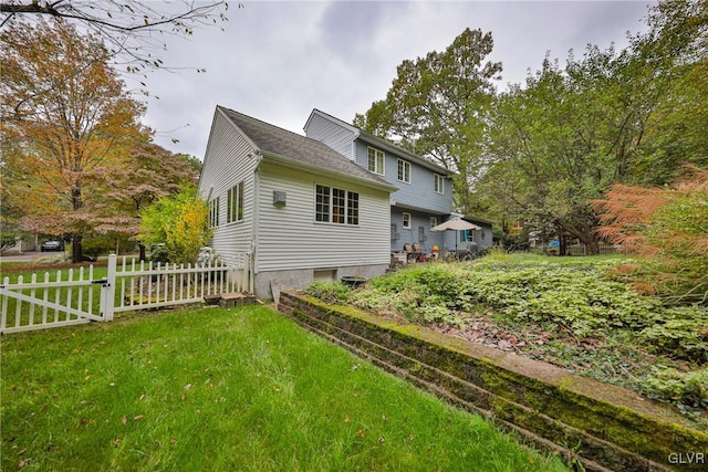 view of home's exterior featuring a lawn