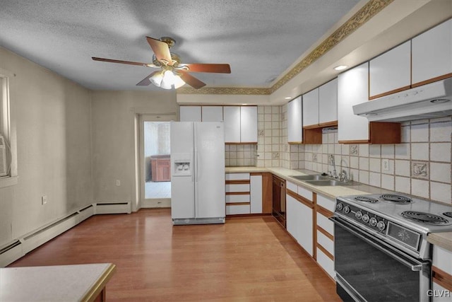 kitchen featuring sink, light wood-type flooring, electric range, white fridge with ice dispenser, and white cabinets