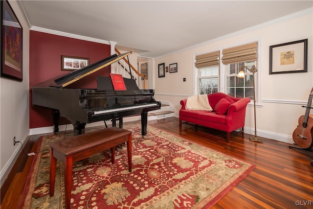 sitting room featuring ornamental molding and wood-type flooring