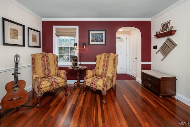 living area featuring crown molding and dark wood-type flooring