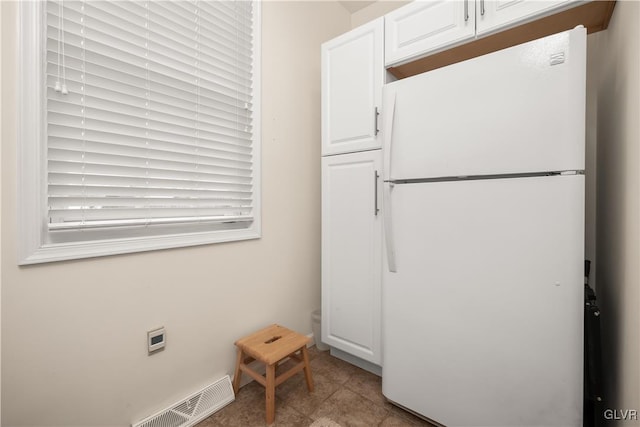 laundry room with light tile patterned flooring