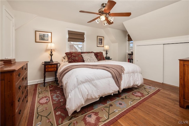 bedroom featuring ceiling fan, hardwood / wood-style floors, and a closet