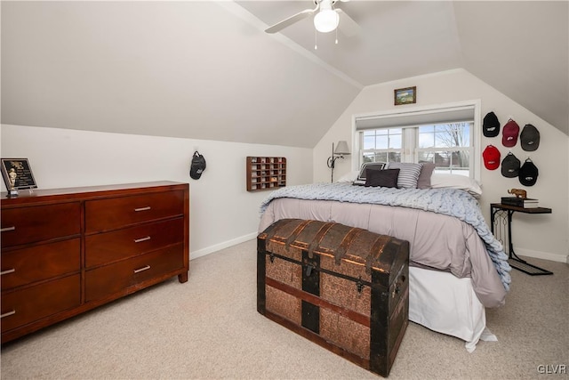 bedroom featuring ceiling fan, lofted ceiling, and light carpet