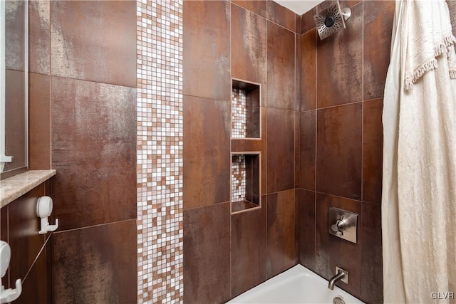 bathroom featuring tiled shower / bath combo