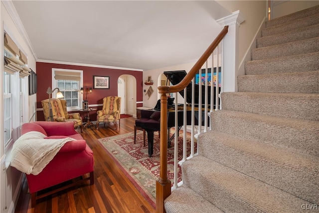 living room featuring hardwood / wood-style flooring and crown molding