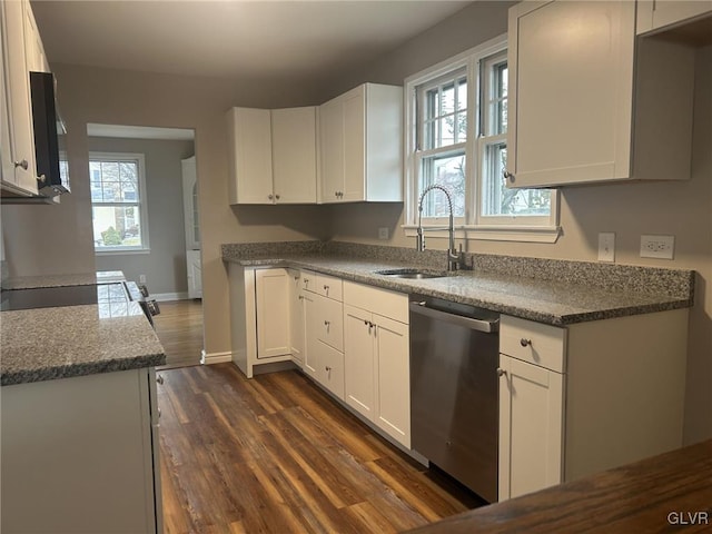 kitchen featuring sink, range, white cabinets, dark hardwood / wood-style flooring, and stainless steel dishwasher