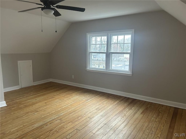 additional living space with lofted ceiling, ceiling fan, and light hardwood / wood-style flooring