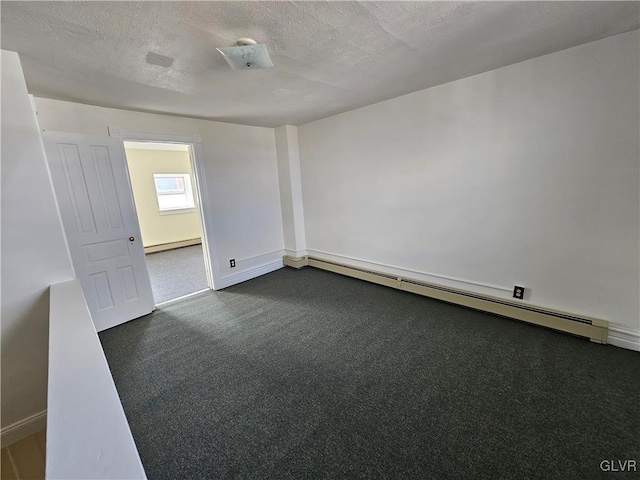 carpeted spare room featuring a baseboard radiator and a textured ceiling