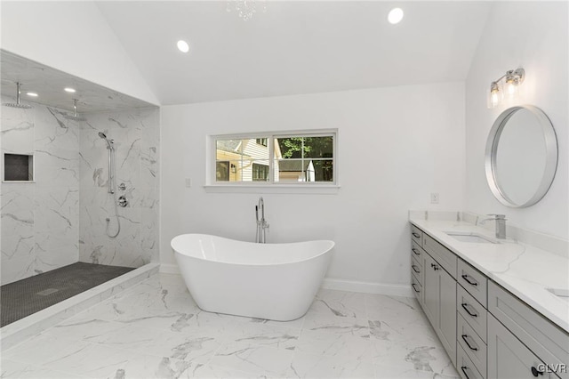 bathroom with vanity, vaulted ceiling, and shower with separate bathtub