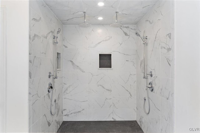 bathroom featuring a tile shower