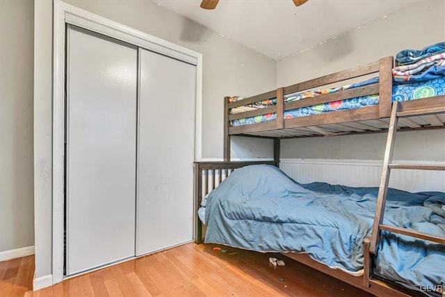 bedroom featuring wood-type flooring and ceiling fan