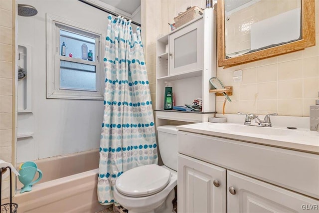 full bathroom featuring vanity, toilet, tile walls, and shower / bath combo with shower curtain