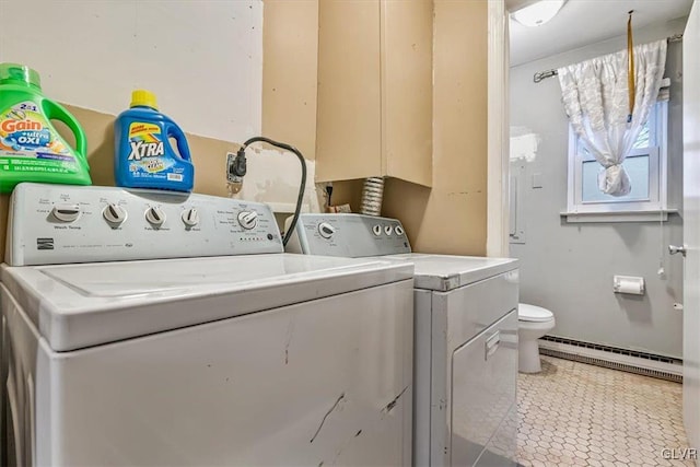 laundry room with washer and clothes dryer, tile patterned flooring, and a baseboard heating unit