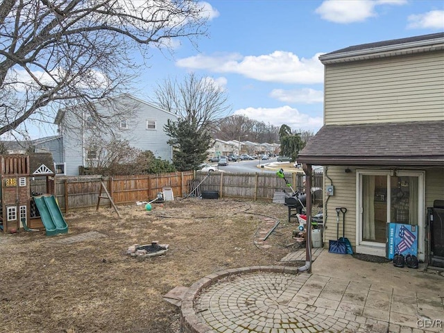 view of yard with a playground and a patio area