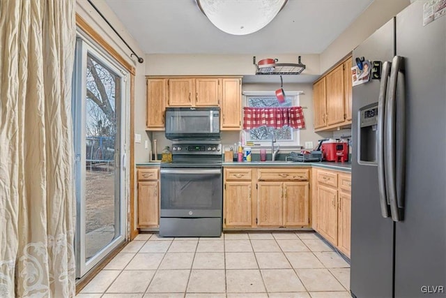 kitchen with stainless steel refrigerator with ice dispenser, light tile patterned flooring, electric stove, and sink