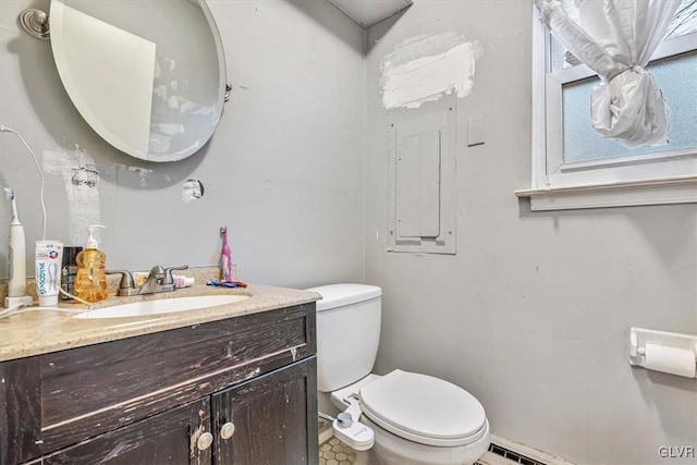 bathroom featuring vanity and toilet