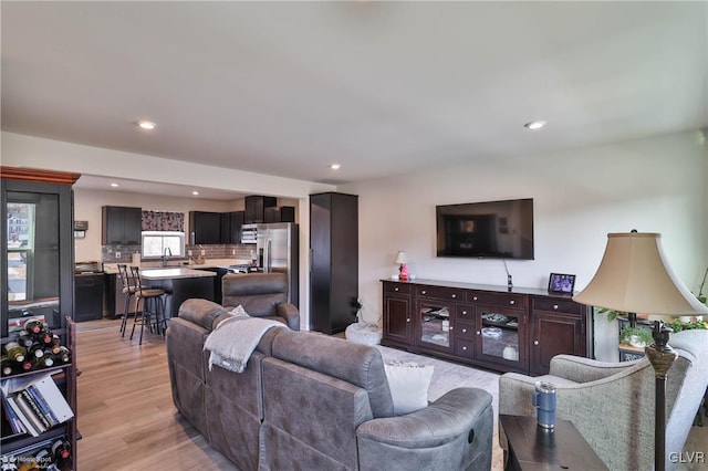 living room with light hardwood / wood-style floors