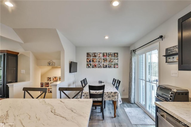 dining area featuring dark wood-type flooring