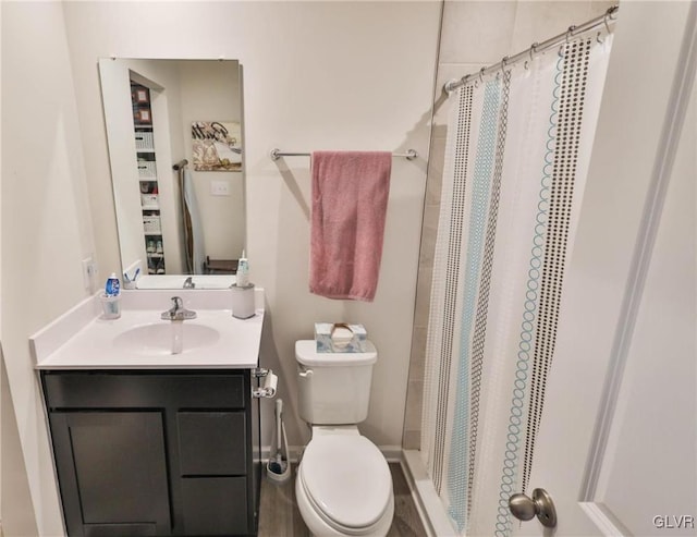 bathroom with vanity, toilet, and a shower with shower curtain