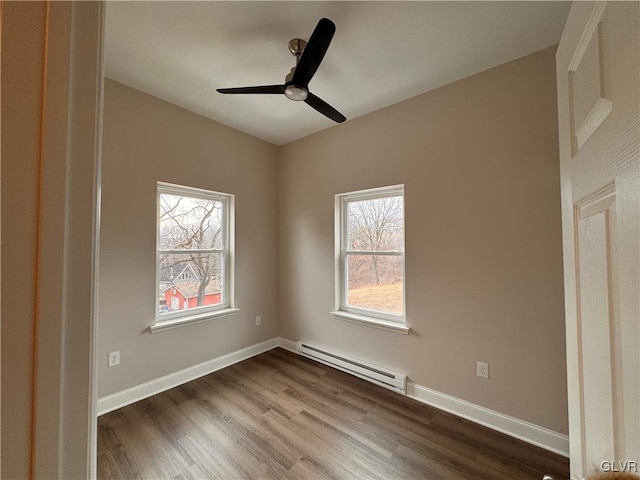 unfurnished bedroom featuring a baseboard heating unit, hardwood / wood-style flooring, and ceiling fan