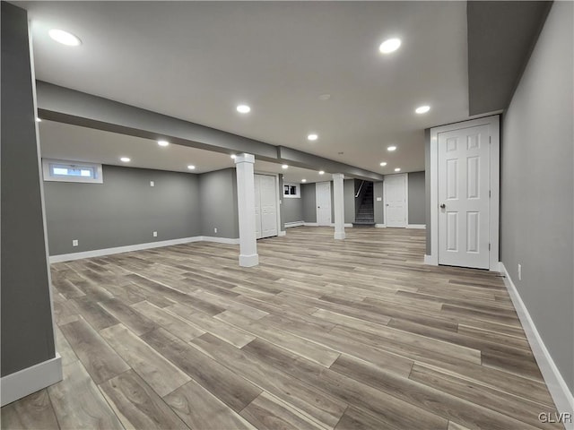 basement featuring light hardwood / wood-style flooring