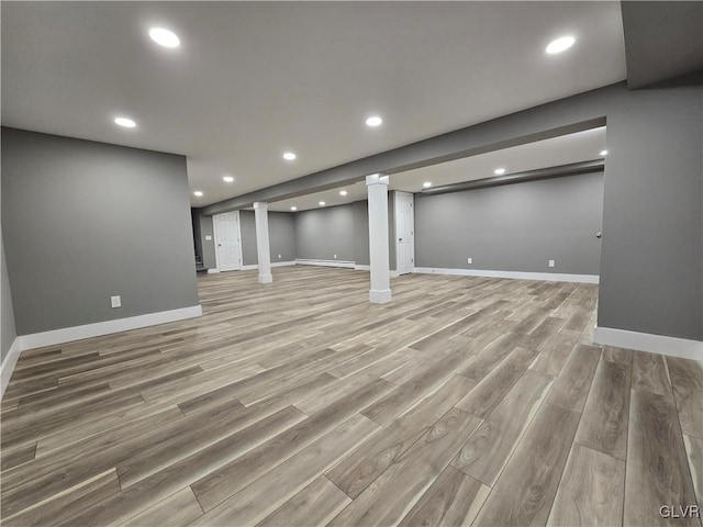 basement featuring light hardwood / wood-style flooring