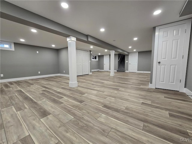 basement featuring light hardwood / wood-style floors