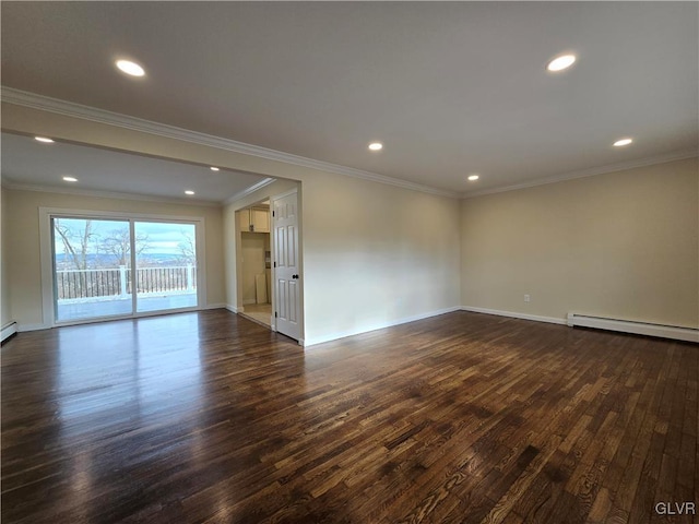 spare room featuring ornamental molding, a baseboard heating unit, and dark hardwood / wood-style flooring