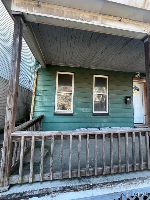 view of property exterior featuring a porch