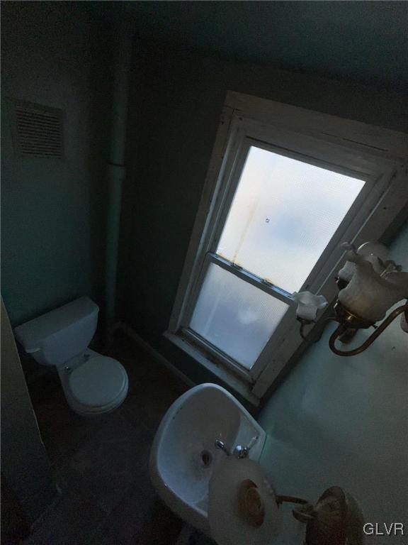 bathroom featuring toilet