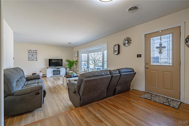 living room with light hardwood / wood-style floors