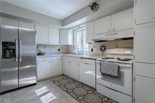 kitchen with backsplash, white appliances, sink, and white cabinets