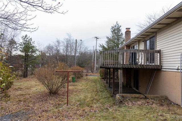 view of yard featuring a wooden deck