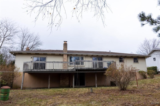 back of house with a wooden deck